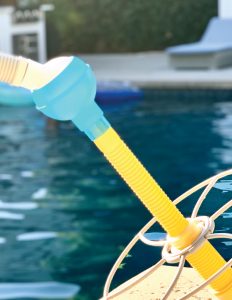 Close up of Pool Pivot attached to pool cleaner and hose.